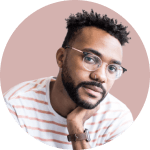 Portrait of Artem, wearing glasses in pondering pose